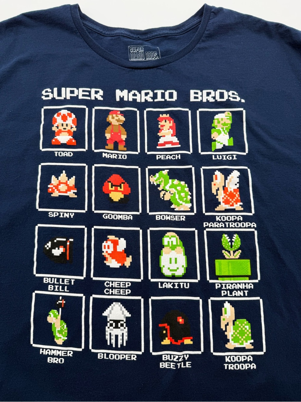 Nintendo Super Mario Bros navy pixel character tee